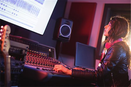 record - Female audio engineer using sound mixer in recording studio Stock Photo - Premium Royalty-Free, Code: 6109-08953686