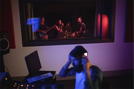 simsearch:6109-08953686,k - Music composer recording music in the studio Stock Photo - Premium Royalty-Free, Code: 6109-08953753