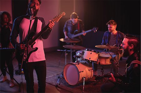 simsearch:6109-08802462,k - Rear view of band performing in recording studio Stock Photo - Premium Royalty-Free, Code: 6109-08953730