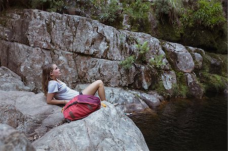 simsearch:400-07310113,k - Young woman relaxing on a rock in countryside Foto de stock - Sin royalties Premium, Código: 6109-08953950