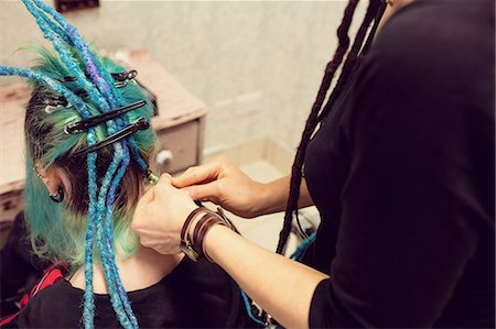 simsearch:633-01273290,k - Beautician styling clients hair in dreadlocks shop Stock Photo - Premium Royalty-Free, Code: 6109-08928359