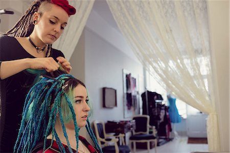 salon owner - Beautician styling clients hair in dreadlocks shop Stock Photo - Premium Royalty-Free, Code: 6109-08928364