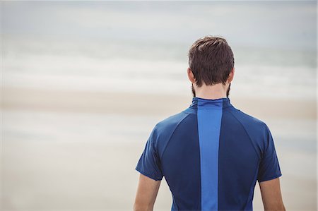 simsearch:6109-08928512,k - Rear view of athlete standing on the beach Stock Photo - Premium Royalty-Free, Code: 6109-08928507