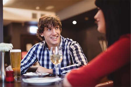 simsearch:6109-08763931,k - Couple having drinks together in restaurant Stock Photo - Premium Royalty-Free, Code: 6109-08928656