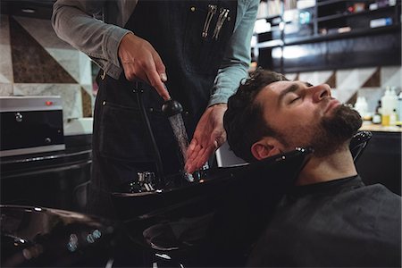 salon - Man getting his hair washed in barber shop Stock Photo - Premium Royalty-Free, Code: 6109-08928788