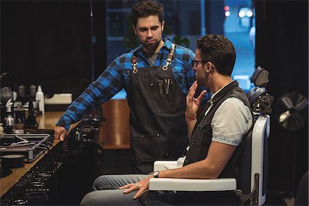 simsearch:693-06324870,k - Client checking his beard after shave in barber shop Stock Photo - Premium Royalty-Free, Code: 6109-08928726