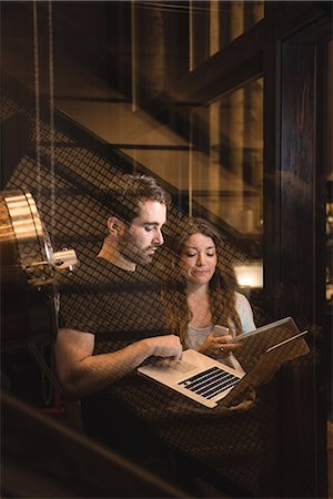 Man and woman discussing over laptop in beer factory Stock Photo - Premium Royalty-Free, Code: 6109-08928947