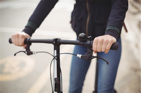 simsearch:862-05996818,k - Mid-section of a woman riding a bicycle Stock Photo - Premium Royalty-Free, Code: 6109-08929224