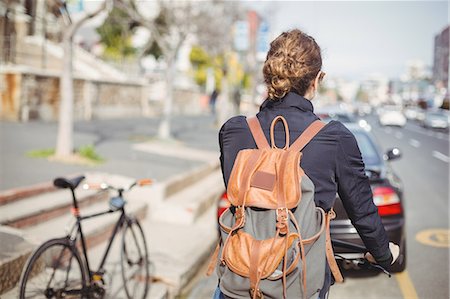 simsearch:841-05846335,k - Rear-view of a woman riding a bicycle on the road Stockbilder - Premium RF Lizenzfrei, Bildnummer: 6109-08929226