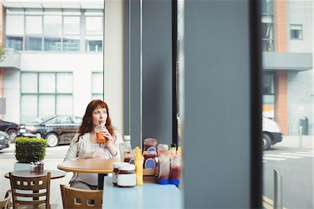 simsearch:649-09025831,k - Pregnant businesswoman having fruit juice in office cafeteria Stock Photo - Premium Royalty-Free, Code: 6109-08929307