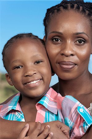 simsearch:6110-06702656,k - Closeup portrait of young African girl and her mother Foto de stock - Royalty Free Premium, Número: 6110-06702641