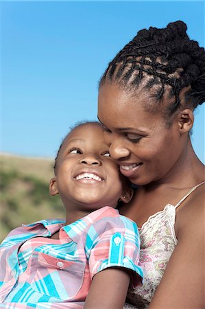 simsearch:6110-06702656,k - Closeup portrait of young African girl and her mother Foto de stock - Royalty Free Premium, Número: 6110-06702644