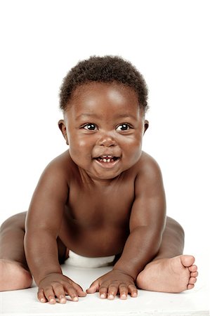 simsearch:6110-06702760,k - An infant sitting in front of a white background Fotografie stock - Premium Royalty-Free, Codice: 6110-06702741