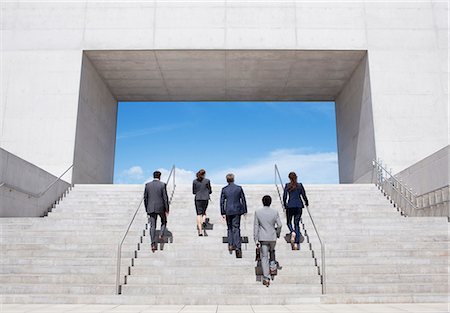 people walking stairs - Business people ascending modern stairs Stock Photo - Premium Royalty-Free, Code: 6113-06497771