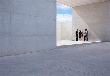 people with architecture - Business people meeting outside modern building Stock Photo - Premium Royalty-Free, Code: 6113-06497776