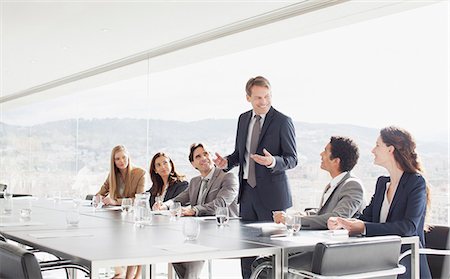 people at work conference room windows - Businessman leading meeting in conference room Stock Photo - Premium Royalty-Free, Code: 6113-06497778