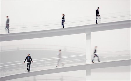 person rushing - Blurred business people walking on elevated walkways Stock Photo - Premium Royalty-Free, Code: 6113-06497805