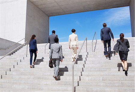 Business people ascending urban stairs Photographie de stock - Premium Libres de Droits, Code: 6113-06497830