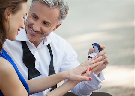 Man with engagement ring proposing to woman Stock Photo - Premium Royalty-Free, Code: 6113-06498176