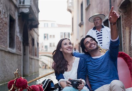 Happy couple in gondola on canal in Venice Stock Photo - Premium Royalty-Free, Code: 6113-06498194