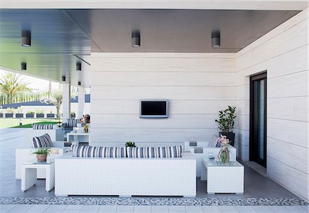 Sofa and television on luxury patio Stock Photo - Premium Royalty-Free, Code: 6113-06498379
