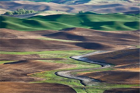 sunlight river - Aerial view of river winding through landscape Stock Photo - Premium Royalty-Free, Code: 6113-06498435