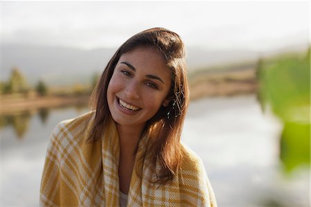 simsearch:6113-06498552,k - Portrait of smiling woman at lakeside Stock Photo - Premium Royalty-Free, Code: 6113-06498500