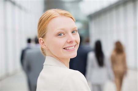 Close up portrait of smiling businesswoman Stock Photo - Premium Royalty-Free, Code: 6113-06498764