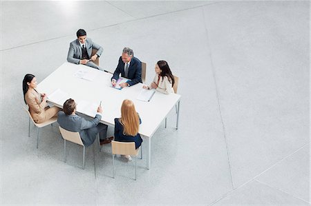 elevated view women sitting - Business people meeting at table Stock Photo - Premium Royalty-Free, Code: 6113-06498791