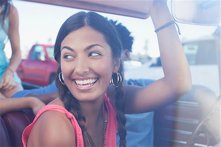 Smiling woman sitting in car Stock Photo - Premium Royalty-Free, Code: 6113-06498920