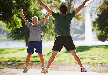 simsearch:6113-06499141,k - Older men doing jumping jacks outdoors Foto de stock - Sin royalties Premium, Código: 6113-06499042
