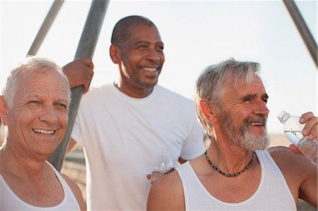 simsearch:6113-06499065,k - Older men relaxing outdoors together Stock Photo - Premium Royalty-Free, Code: 6113-06499056