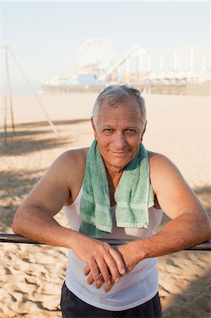 simsearch:6113-06499118,k - Older man relaxing after workout on beach Stock Photo - Premium Royalty-Free, Code: 6113-06499067