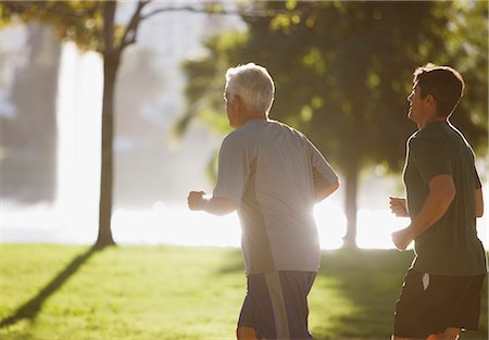 senior citizens jogging - Older men jogging together in park Stock Photo - Premium Royalty-Free, Code: 6113-06499029