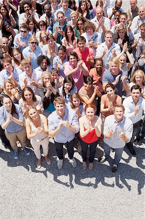 sunshine community - Portrait of smiling crowd clapping Stock Photo - Premium Royalty-Free, Code: 6113-06499154