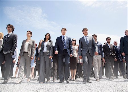 people walk low angle - Crowd of business people walking Stock Photo - Premium Royalty-Free, Code: 6113-06499163