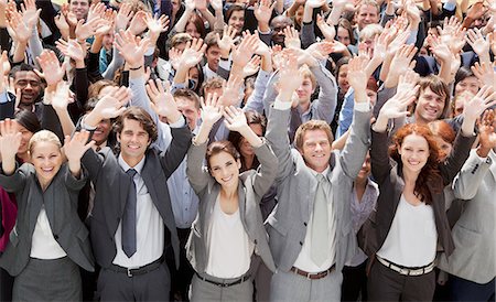 Portrait of cheering business people in crowd Stock Photo - Premium Royalty-Free, Code: 6113-06499161