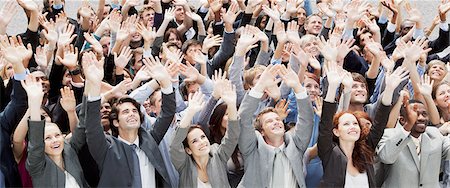 enthusiastic fans - Crowd of business people cheering with arms raised Stock Photo - Premium Royalty-Free, Code: 6113-06499177