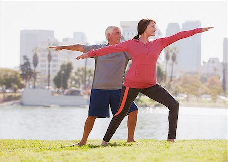 simsearch:6113-06499037,k - Older couple practicing yoga outdoors Stock Photo - Premium Royalty-Free, Code: 6113-06499106