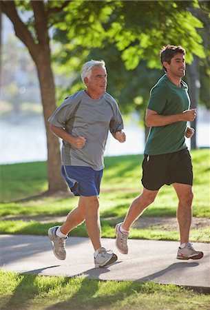 senior man exercising - Men jogging together in park Stock Photo - Premium Royalty-Free, Code: 6113-06499109