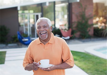 Older man having cup of coffee in backyard Stock Photo - Premium Royalty-Free, Code: 6113-06499137