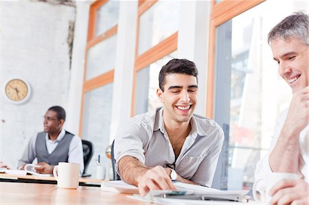 Businessmen talking in office Stock Photo - Premium Royalty-Free, Code: 6113-06625483