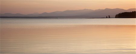 Sunset sky reflected in rural lake Stock Photo - Premium Royalty-Free, Code: 6113-06625497