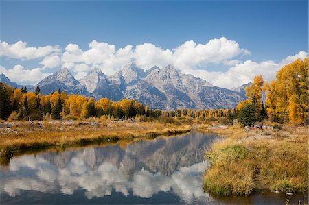 Mountains and landscape reflected in still river Stock Photo - Premium Royalty-Free, Code: 6113-06625529