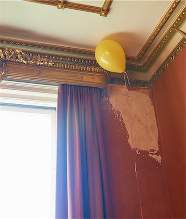 Balloon floating in corner of ornate room Stock Photo - Premium Royalty-Free, Code: 6113-06625661