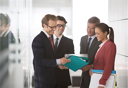 simsearch:6113-06625746,k - Business people talking in office hallway Stock Photo - Premium Royalty-Free, Code: 6113-06625689