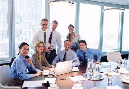 simsearch:6113-06625746,k - Business people smiling in meeting Stock Photo - Premium Royalty-Free, Code: 6113-06625750