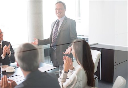 simsearch:6113-06625735,k - Business people applauding colleague in meeting Stock Photo - Premium Royalty-Free, Code: 6113-06625758