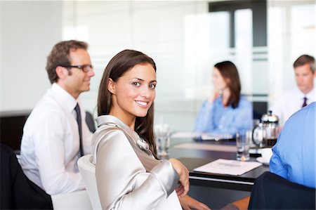 simsearch:6113-06625735,k - Businesswoman smiling in meeting Stock Photo - Premium Royalty-Free, Code: 6113-06625803