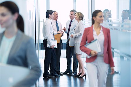 simsearch:6113-06625735,k - Business people talking in office hallway Stock Photo - Premium Royalty-Free, Code: 6113-06625832